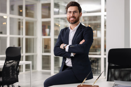 Portrait of smiling man with crossed arms in office, space for text. Lawyer, businessman, accountant...