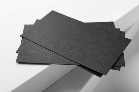 Blank black business cards on light background, closeup. Mockup for designの写真素材