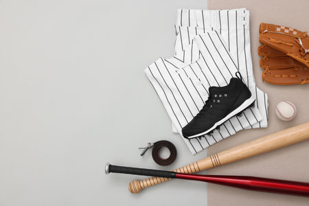 Flat lay composition with baseball uniform and sports equipment on color background. Space for textの写真素材