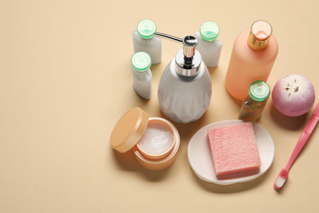 Bath accessories. Personal care products on beige background, above view. Space for text