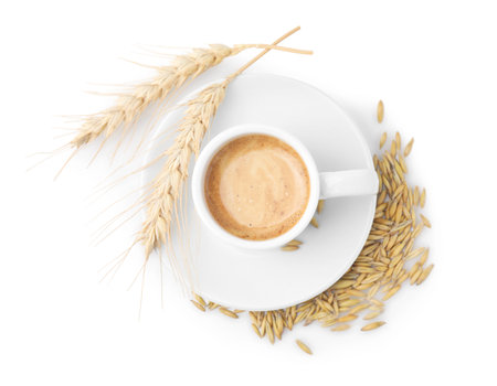 Cup of barley coffee, grains and spikes isolated on white, top viewの写真素材