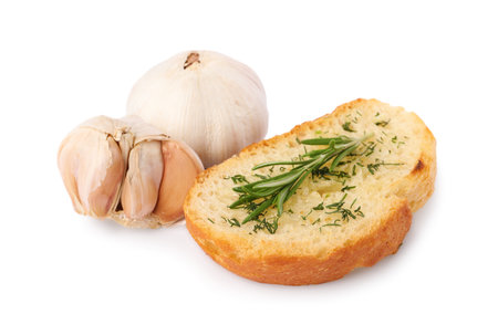 Piece of tasty baguette with garlic, rosemary and dill isolated on whiteの写真素材