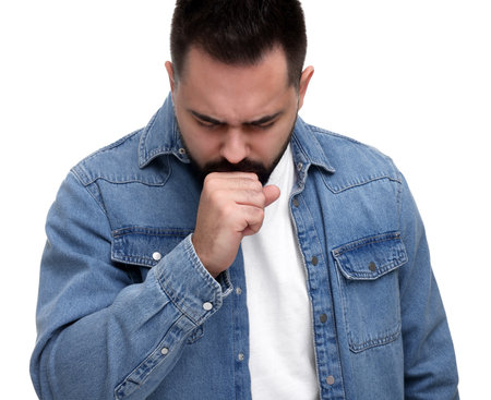 Sick man coughing on white background. Cold symptomsの写真素材