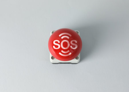 Red SOS button on white background. Space for textの写真素材