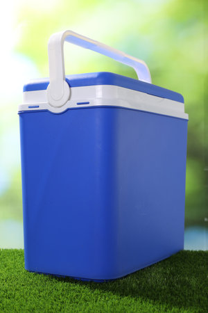 One plastic cool box on artificial grass, closeupの写真素材
