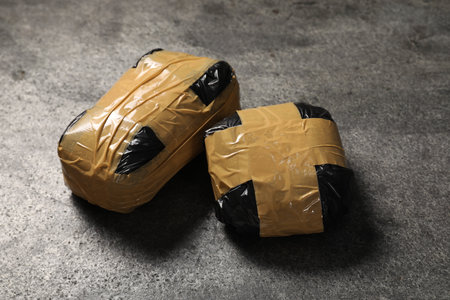 Packages with drugs on gray textured tableの写真素材