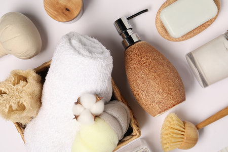 Bath accessories. Different personal care products and cotton flower on white background, flat layの写真素材