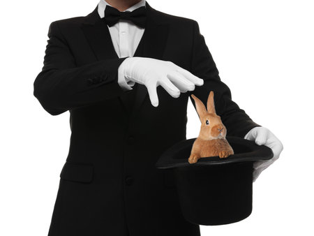Magician showing trick with top hat and rabbit on white background, closeupの写真素材