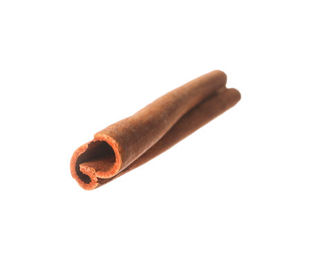 One aromatic cinnamon stick isolated on whiteの写真素材