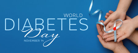 World Diabetes Day. People holding light blue ribbon with paper blood drop on color background, top view. Banner designの写真素材