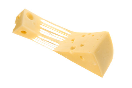 Tasty cheese stretching in air on white backgroundの写真素材