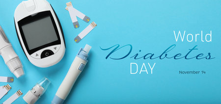 World Diabetes Day. Digital glucometer, lancet pens and test strips on light blue background, flat lay. Banner designの写真素材