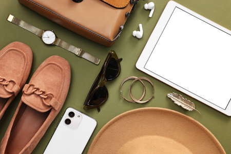Flat lay composition with modern tablet on olive background. Space for textの写真素材
