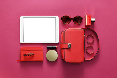 Flat lay composition with modern tablet on hot pink background. Space for textの写真素材