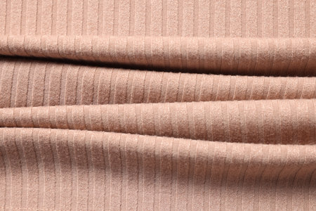 Texture of beige fabric as background, top view