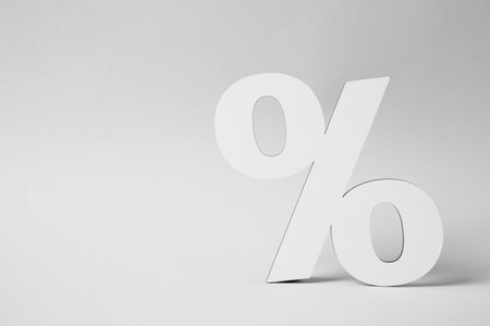 White percent sign on light gray background. Space for text