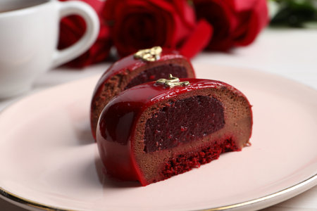 St. Valentine's Day. Pieces of delicious cake served on table, closeup