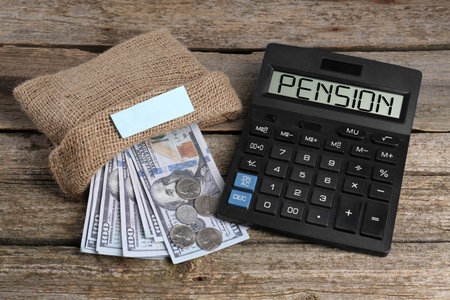 Calculator with word Pension and money on wooden tableの写真素材