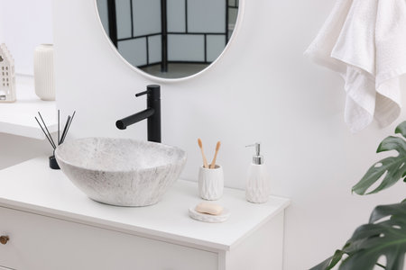 Different bath accessories and personal care products in bathroomの写真素材