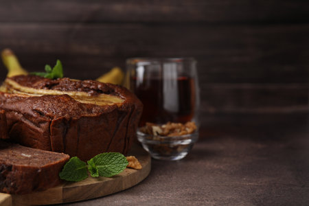 Delicious banana bread on brown table, closeup. Space for textの写真素材