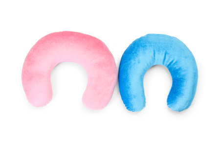 Pink and blue travel pillows isolated on white, top viewの写真素材