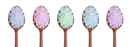 Different sea salt in spoons isolated on white, top viewの写真素材