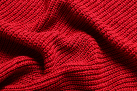 Texture of soft red knitted fabric as background, top viewの写真素材