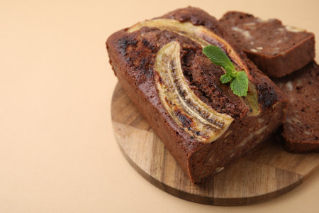 Delicious banana bread with mint on beige background, closeupの写真素材