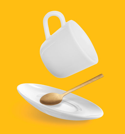 Spoon, cup and saucer falling on orange backgroundの写真素材