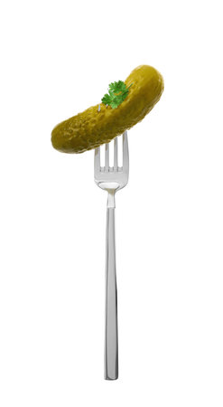 Fork with pickled cucumber isolated on whiteの写真素材