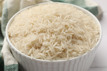 Raw basmati rice in bowl on table, closeupの写真素材
