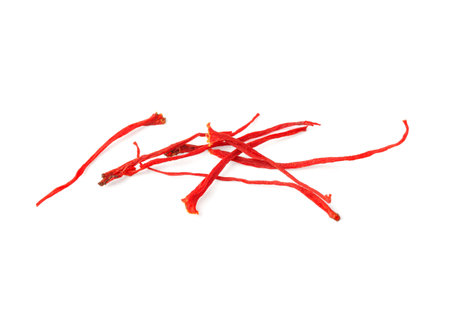 Stigmas of aromatic saffron isolated on whiteの写真素材