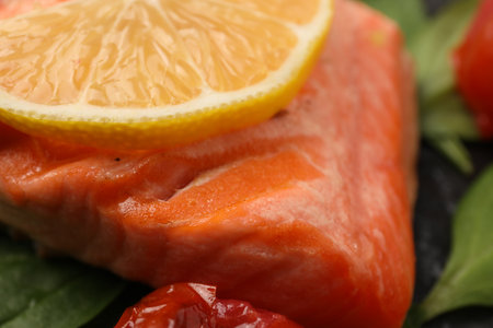 Tasty grilled salmon with lemon on plate, closeupの写真素材
