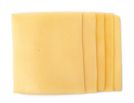 Slices of tasty fresh cheese isolated on white, top viewの写真素材