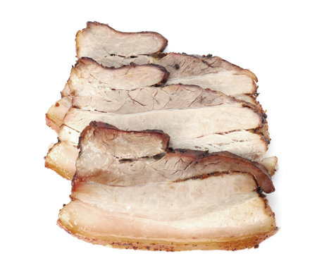Slices of tasty baked pork belly isolated on white, top viewの写真素材