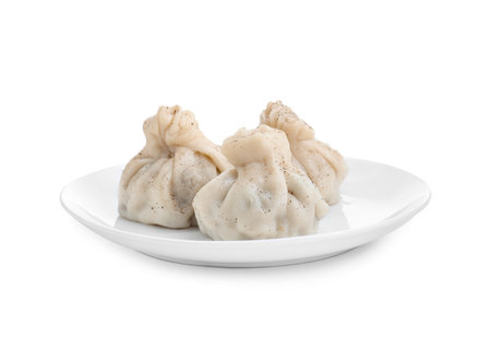 Plate with three tasty khinkali (dumplings) and spices isolated on white. Georgian cuisineの写真素材