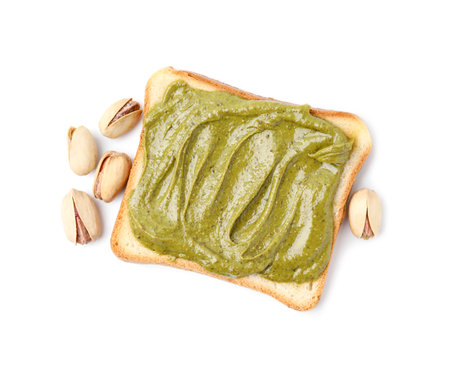 Toast with tasty pistachio cream and nuts isolated on white, top viewの写真素材