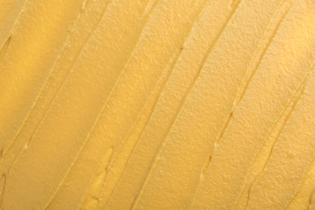 Fresh tasty mustard sauce as background, top viewの写真素材