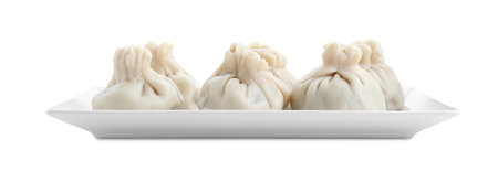 Plate with tasty fresh khinkali (dumplings) isolated on white. Georgian cuisineの写真素材
