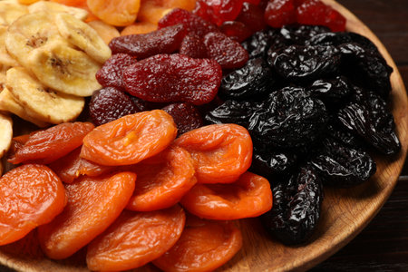 Different delicious dried fruits on table, closeupの写真素材