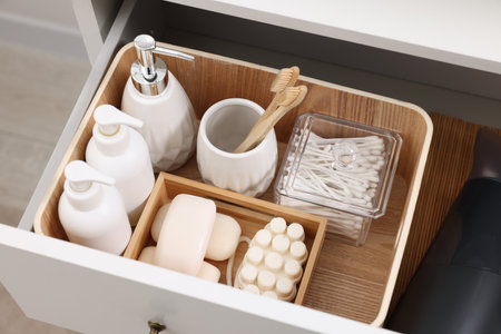 Different bath accessories and personal care products in drawer indoors, above viewの写真素材