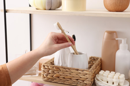 Bath accessories. Woman organizing personal care products indoors, closeupの写真素材