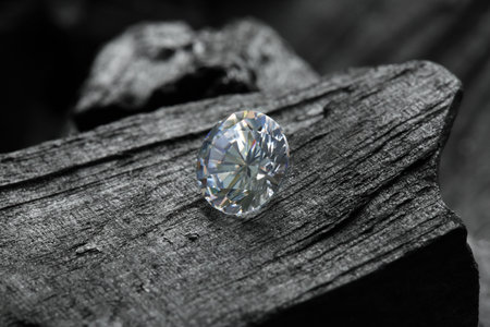 Beautiful shiny diamond on coal, closeup viewの写真素材