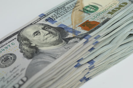 Money exchange. Dollar banknotes on white background, closeupの写真素材