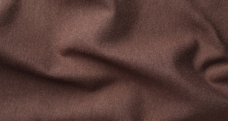 Texture of brown crumpled fabric as background, top view