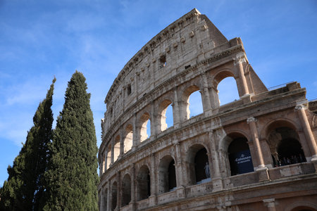 Rome, Italy - February 4, 2024 : Colosseum against light blue sky, low angle viewの写真素材