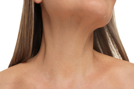 Mature woman showing her neck on white background, closeupの写真素材