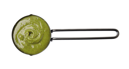 Tasty pistachio cream in scoop isolated on white, top viewの写真素材