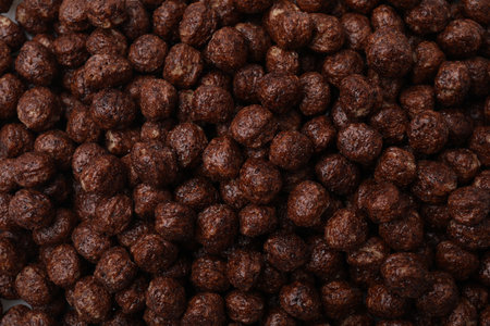 Tasty chocolate cereal balls as background, top viewの写真素材