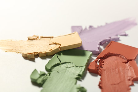 Samples of different color correcting concealers on white background, closeupの写真素材
